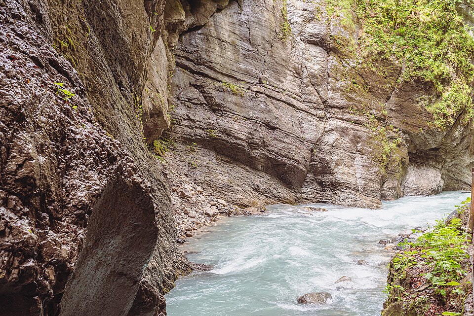 Milky-blue water of the Partnach flowing through a narrow limestone gorge.